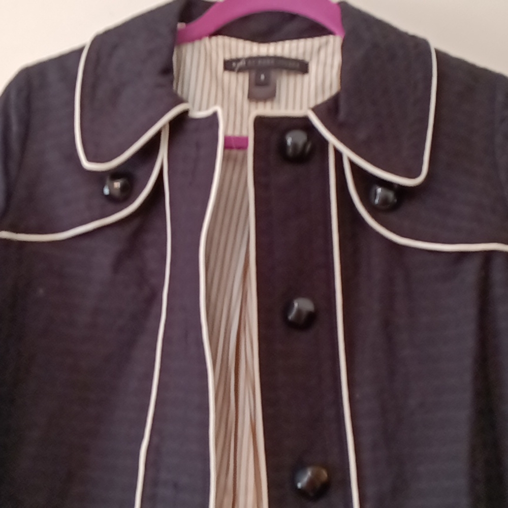 Black coat with white trim